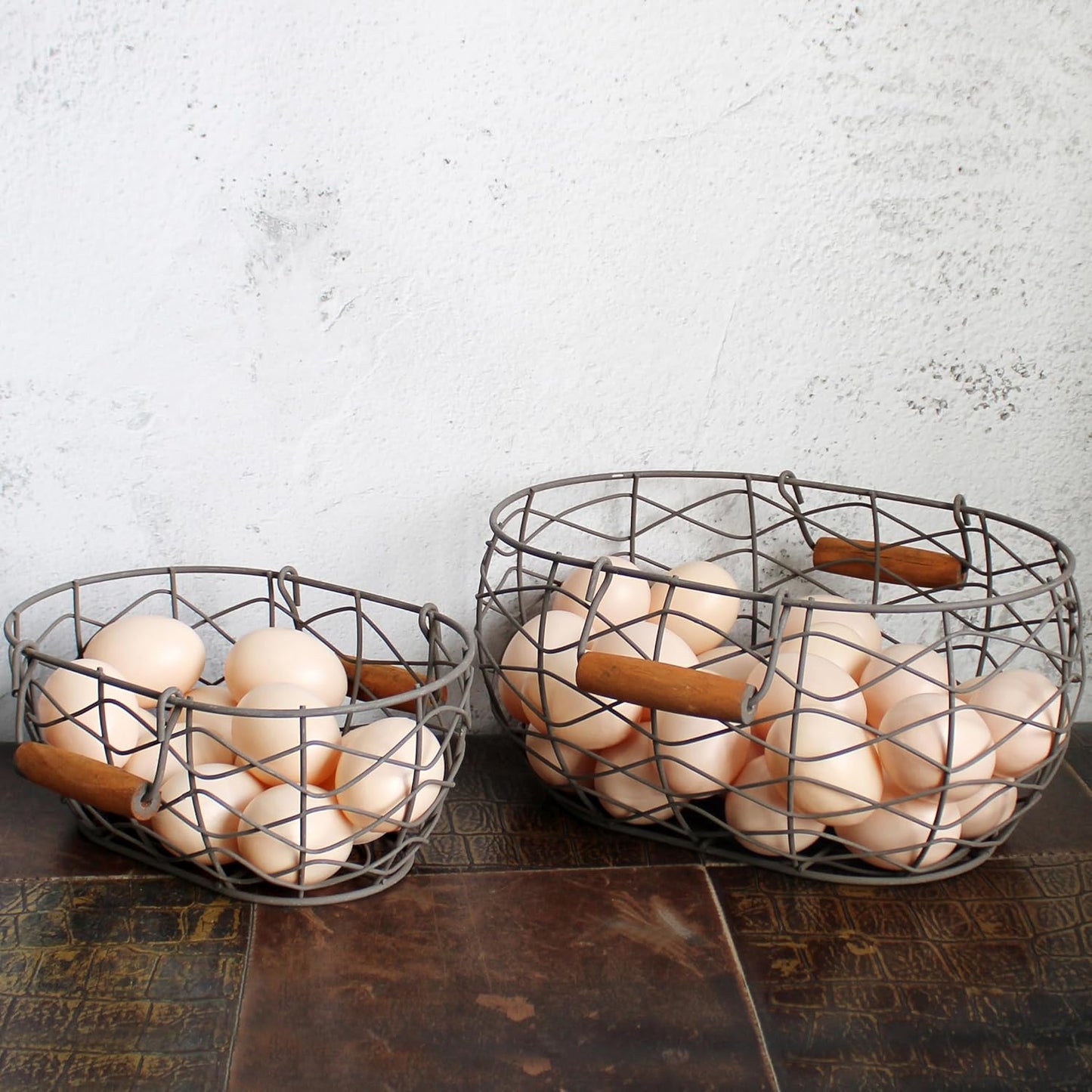 CVHOMEDECO. Oval Wire Egg Baskets Rustic Fruit Baskets with Wooden Handles Primitives Vintage Gathering Basket. Rusty, Set of 2