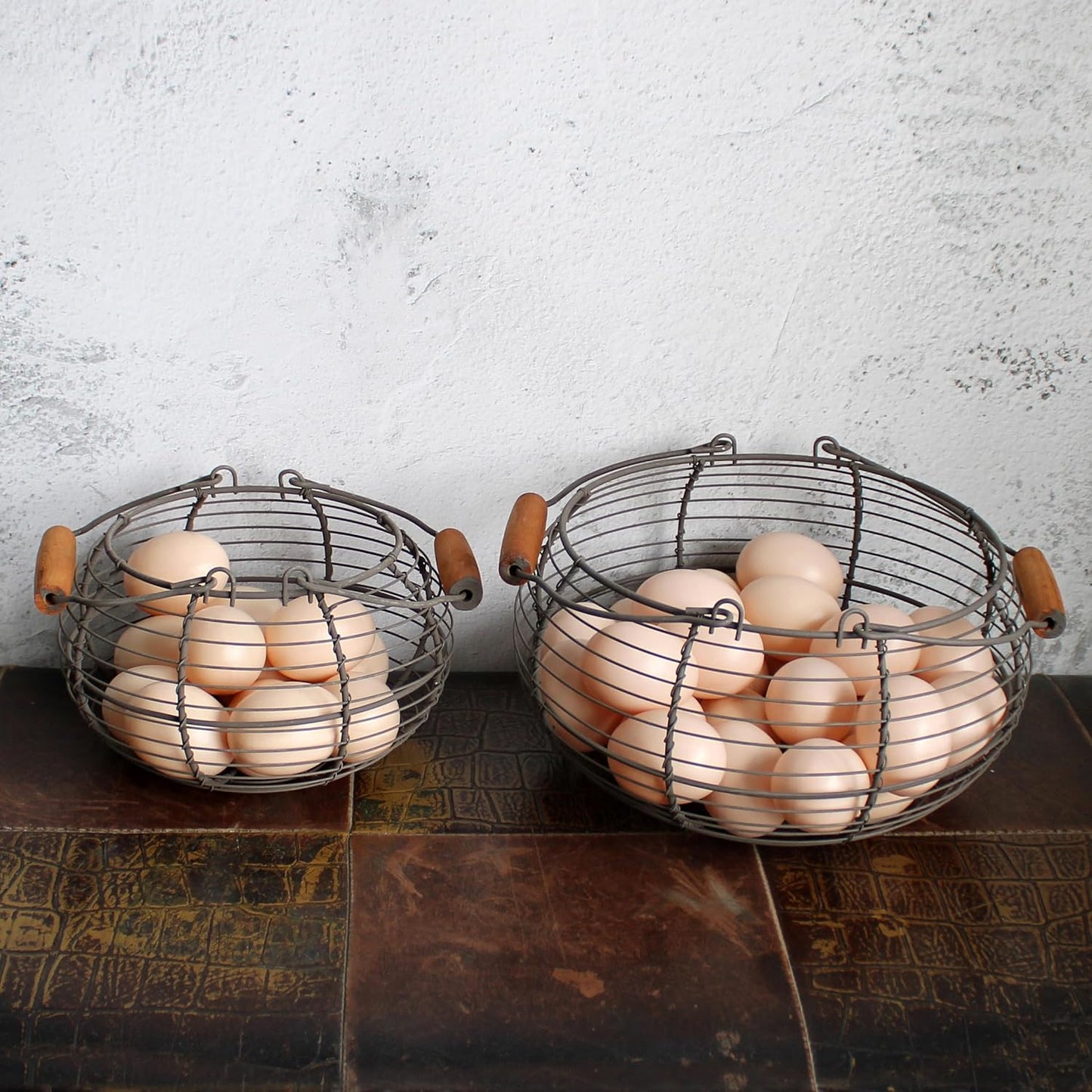 CVHOMEDECO. Round Wire Egg Baskets Rustic Fruit Baskets with Wooden Handles Primitives Vintage Gathering Basket. Rusty, Set of 2